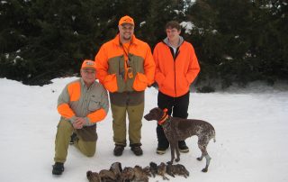 dog and hunters after pheasant hunting
