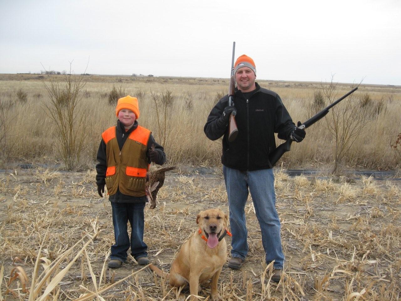 father and son with dog before pheasant hunting - SITKA gear at Longmeadow