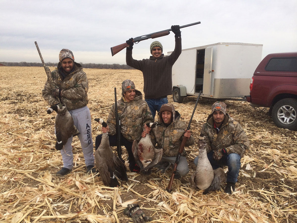 Goose hunters with their quarry